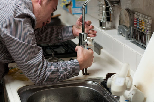Plumber at work to provide reliable, expert Bowie plumbing service. Call Belair today!